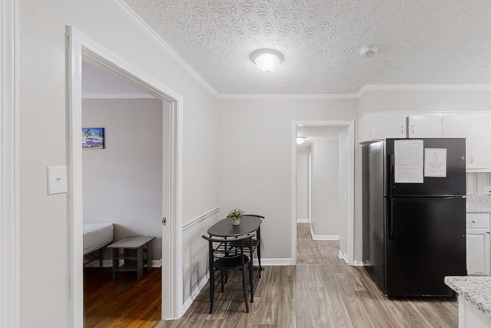 Dining area with cafe table and refrigerator